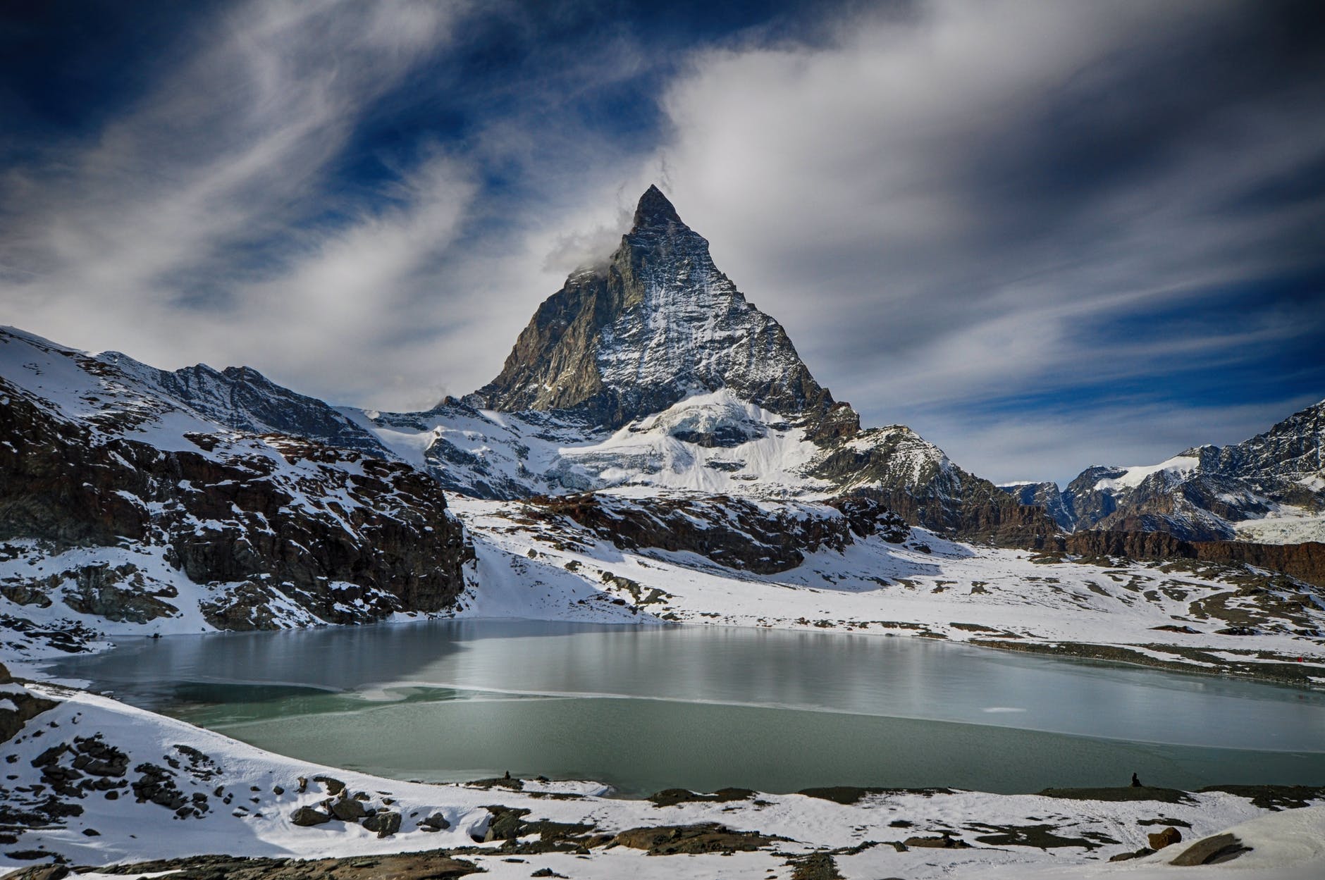 white mountain under gray sky